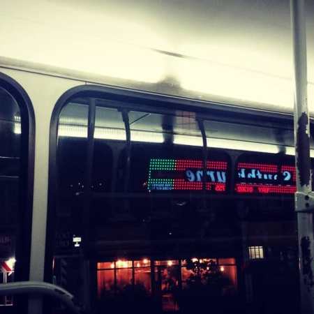 An image showing the inside of a bus or London Tube carriage