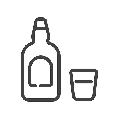 Clipart image of a bottle and glass of liquor.